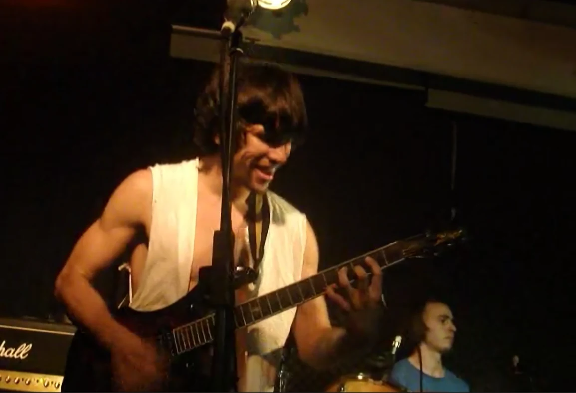 Guitarist performing with Davide on drums